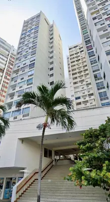 a palm tree in front of a building with stairs at Vista Lateral al Mar, ApartaEstudio , Cerca Hotel Hilton y Salida al Mar in Cartagena de Indias