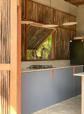 a kitchen with a stove and a window at Serenity Home in San Bernardo del Viento