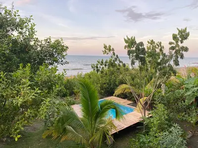 a view of the beach from a resort with a pool at Serenity Home in San Bernardo del Viento