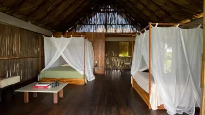 a bedroom with a bed and a table in a room at Serenity Home in San Bernardo del Viento