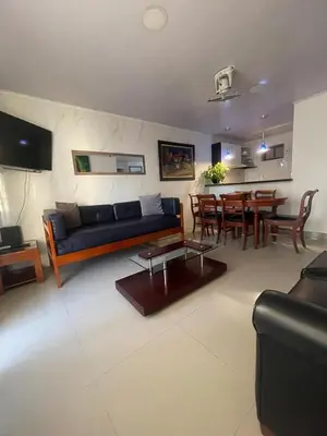 a living room with a couch and a table at Vista Hermosa Portofino in Cartagena de Indias