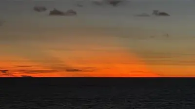 a sunset over the ocean with the sky at Vista Hermosa Portofino in Cartagena de Indias