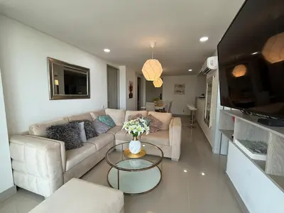 a living room with a couch and a table at Hermoso apartamento moderno con vista al mar in Cartagena de Indias