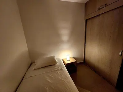 a small room with a bed with a light on it at New and with an ocean view in Cartagena de Indias