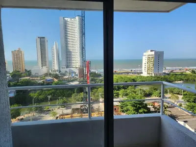 a balcony with a view of the ocean and buildings at New and with an ocean view in Cartagena de Indias