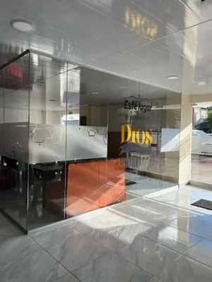 a glass wall in a room with a desk at Hotel Brisas in Tierra Bomba