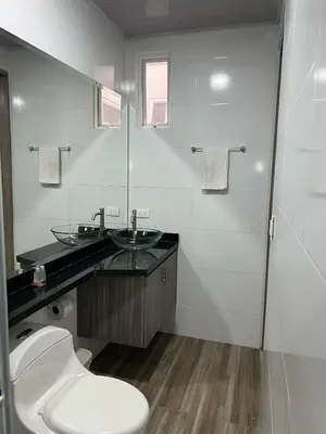 a bathroom with a toilet and a sink at Hotel Brisas in Tierra Bomba