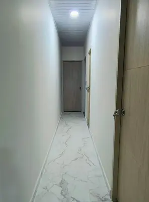 a hallway with white walls and a room with a hallwayngth at Cactus Beach Stay APARTAMENTO in Santa Marta