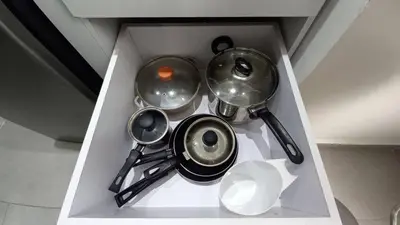 a bunch of pots and pans in a drawer at PISO 12 Cerca a la playa, Piscina, Wifi, AC in Cartagena de Indias