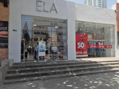 a store front with steps in front of a store at PISO 12 Cerca a la playa, Piscina, Wifi, AC in Cartagena de Indias