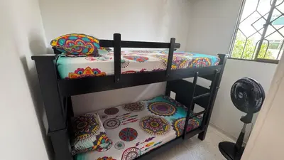 a couple of bunk beds in a room at Apartamento central en Barranquilla in Barranquilla