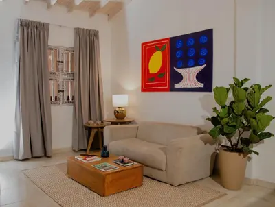 a living room with a couch and a coffee table at Apartamento Benitez 301 by Zakher in Cartagena de Indias