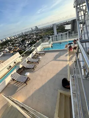 a swimming pool on the top of a building at Cómodo y Comfortable Apto in Cartagena de Indias