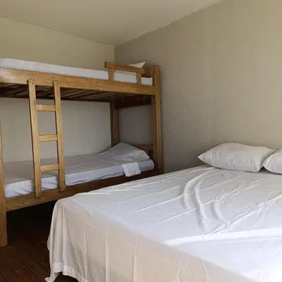 a bedroom with two bunk beds and a ladder at Arumake in Turbaco