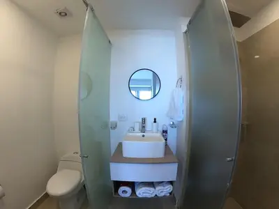 a bathroom with a sink and a shower at Crespo Horizon Suite in Cartagena de Indias