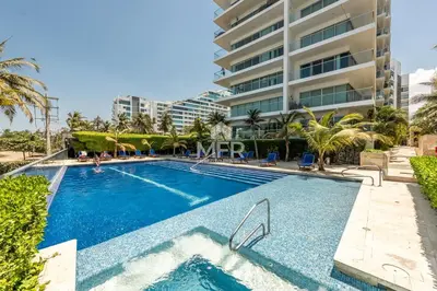 a swimming pool in front of a building at Edificio Morros Vitri, 2 Bedrooms- Comfy Apartment in Cartagena de Indias