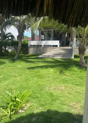 a park with a bench and some grass and trees at Playa del Toro in El Bobo