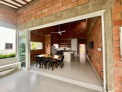 a kitchen and dining room with a brick wall at Playa del Toro in El Bobo