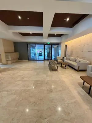 a large lobby with couches and tables in a building at Murano Centro1 26floor,rooftop,infinity pool & views byIMZ in Cartagena de Indias