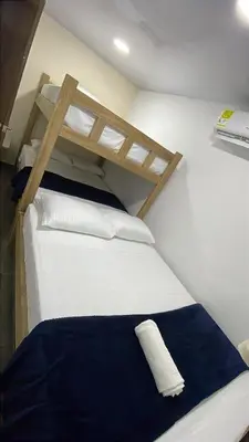 a bedroom with two bunk beds in a room at Hotel Casablanca in Galapa