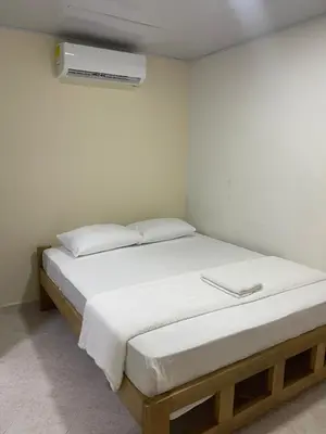 a bedroom with a bed and a air conditioner at Hotel Casablanca in Galapa