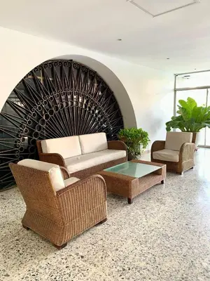 a living room with two chairs and a couch and a table at apartamento con vista al Lago in Cartagena de Indias
