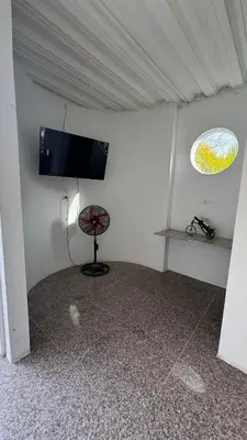 a room with a flat screen tv in a tent at Cabañas en Cartagena JhonliMar in Isla de Tierra Bomba