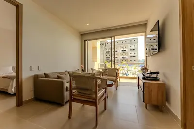a living room with a couch and a table at Baia Kristal Cartagena in Cartagena de Indias