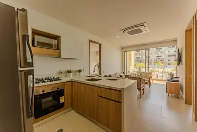 a kitchen with a sink and a stove top oven at Baia Kristal Cartagena in Cartagena de Indias