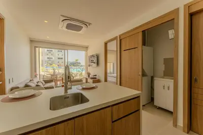a kitchen with a sink and a large window at Baia Kristal Cartagena in Cartagena de Indias