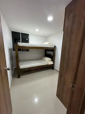 a small room with two bunk beds in it at Cozy apartment in the heart of Barranquilla in Barranquilla
