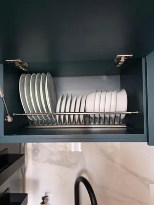 a shelf with plates and towels in a kitchen at Open Floor Chic Interior Design Pool Full Kitchen in Barranquilla