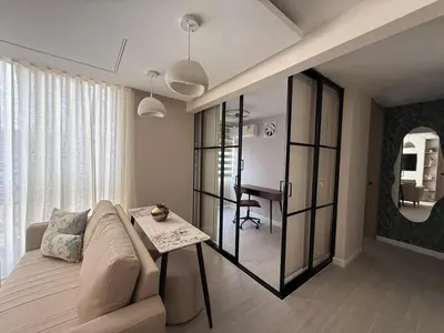 a living room with a couch and a table at Open Floor Chic Interior Design Pool Full Kitchen in Barranquilla