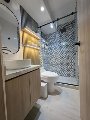 a bathroom with a toilet and a shower at Open Floor Chic Interior Design Pool Full Kitchen in Barranquilla
