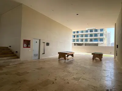 an empty room with two benches in a building at sui lofts 1609 in Santa Marta