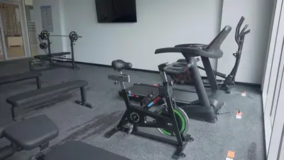 a gym with several exercise bikes in a room at sui lofts 1609 in Santa Marta