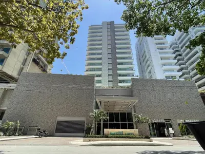 a building in a city with tall buildings at sui lofts 1609 in Santa Marta