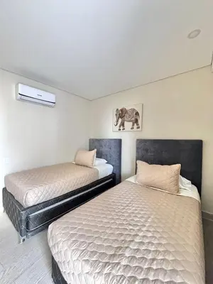 two beds in a room with two beds sidx sidx sidx at Martinique 1001 luxure escape & comfort in Cartagena de Indias