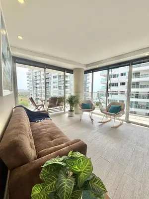 a living room with a couch and chairs and windows at Martinique 1001 luxure escape & comfort in Cartagena de Indias