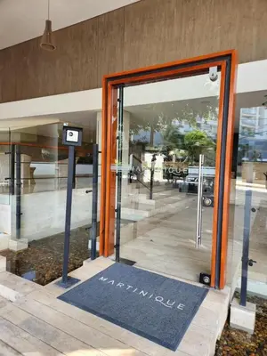 an open door of a building with a sign on it at Martinique 1001 luxure escape & comfort in Cartagena de Indias