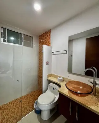 a bathroom with a toilet and a sink and a shower at Inolvidables atardeceres en Cartagena in Cartagena de Indias