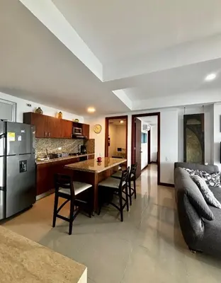 a kitchen and living room with a table and a couch at Inolvidables atardeceres en Cartagena in Cartagena de Indias