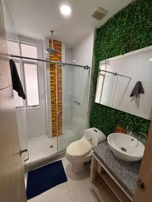 a bathroom with a shower and a toilet and a sink at Refugio junto al mar en el Cabrero in Cartagena de Indias