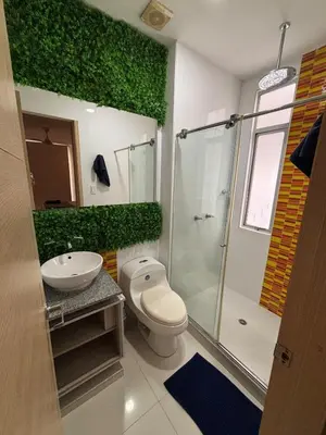 a bathroom with a toilet and a sink and a shower at Refugio junto al mar en el Cabrero in Cartagena de Indias