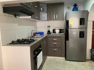 a kitchen with a stainless steel refrigerator and cabinets at PrinSha#2 in Cartagena de Indias