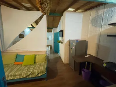 a room with a bed with a tent at Apartaestudios Ofir in Barranquilla