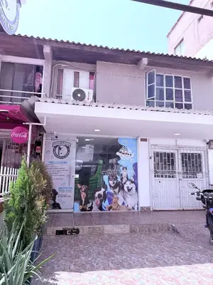 a store front of a house with posters on it at Luxury CTG Condo Near Beach Cold AC & Hot Water in Cartagena de Indias