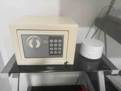 a microwave sitting on top of a shelf with a cup at Luxury CTG Condo Near Beach Cold AC & Hot Water in Cartagena de Indias