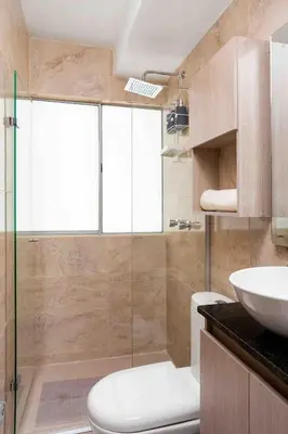 a bathroom with a toilet and a sink at Luxury CTG Condo Near Beach Cold AC & Hot Water in Cartagena de Indias