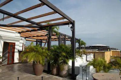 a pergola on top of a building with plants at Hotel Boutique Patio Corao in Cartagena de Indias